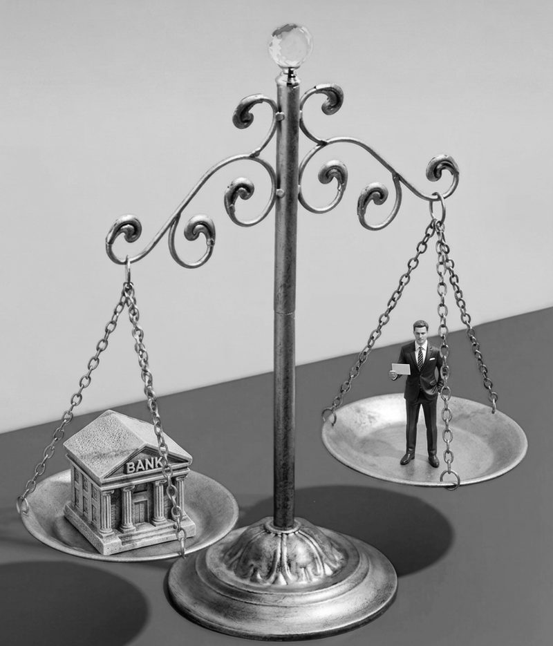 Balance scales weighing a bank building against a mortgage broker