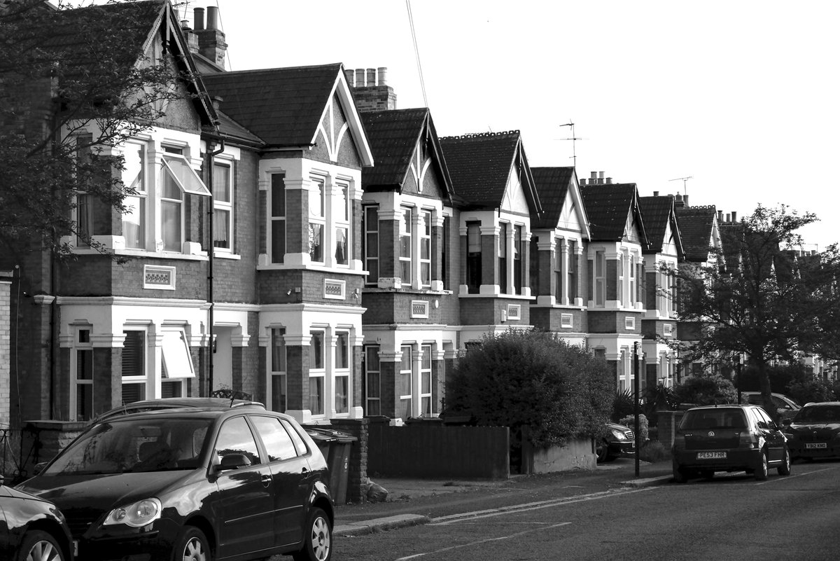 Row of British terraced houses on a residential street