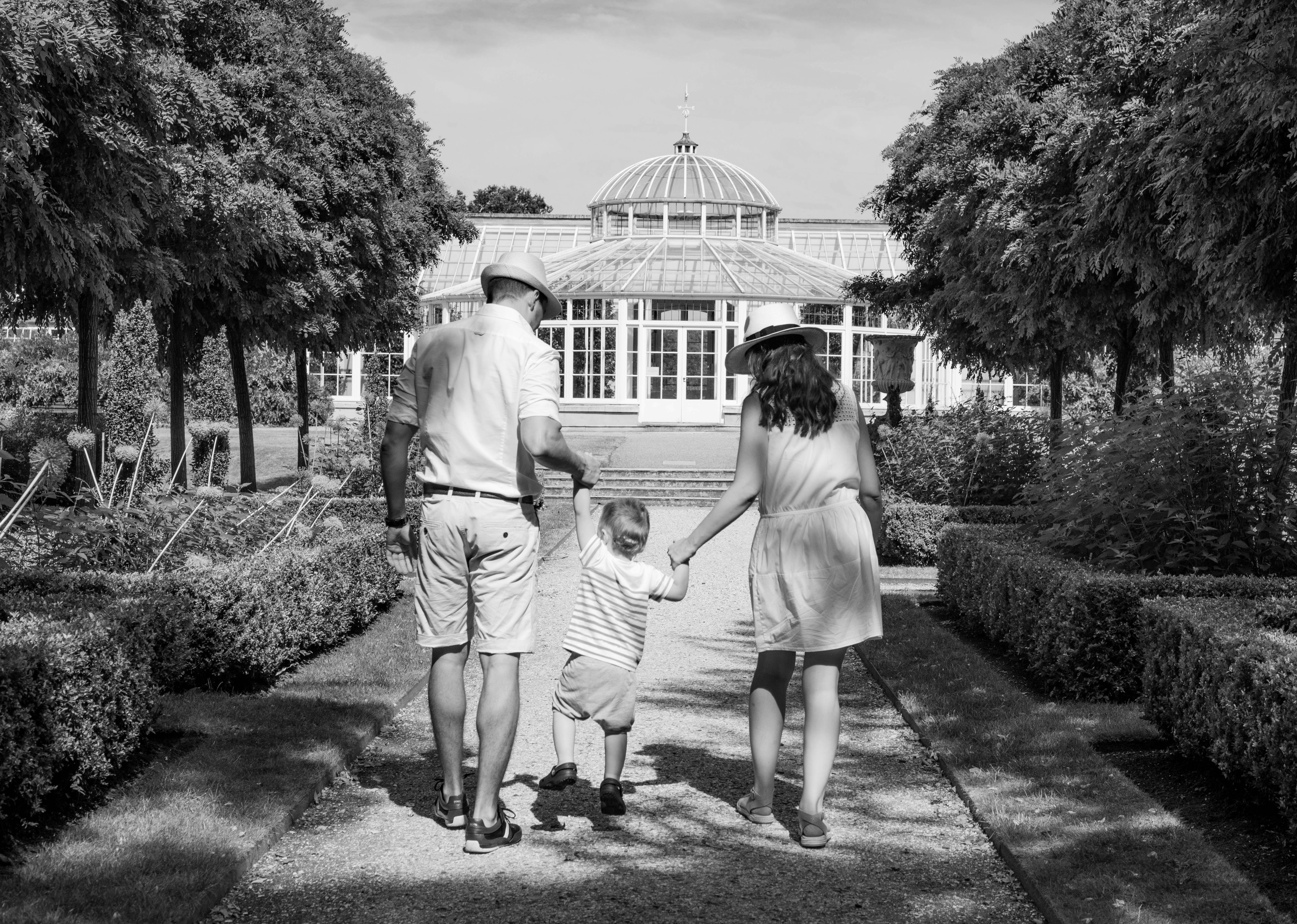 A Hertfordshire family walking through local parkland near Kings Langley